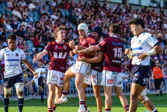 Mac Grealy, pictured celebrating one of his tries for the Queensland Reds, impressed against Wild Knights on Saturday.