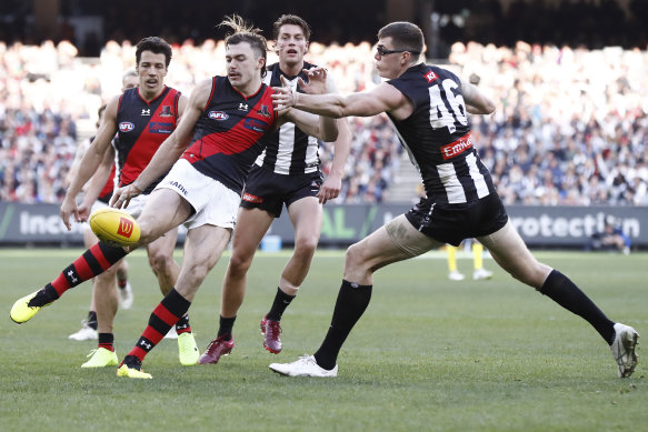 Sam Draper comes in for plenty of attention as he looks to get a kick away.