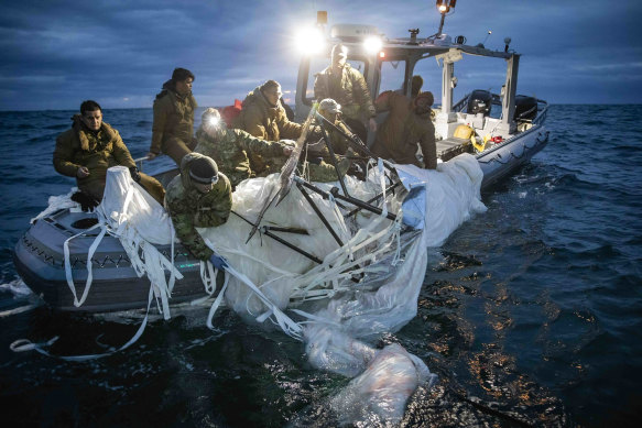 The navy recovers debris from the balloon shot down off the coast of South Carolina.