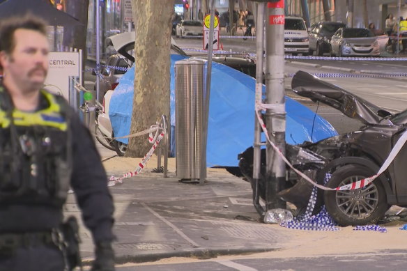 The scene of the crash at the corner of Bourke and Russell streets on Friday night.