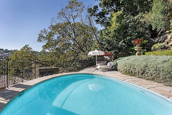 There are multiple leisure zones including a pool and stone courtyard.