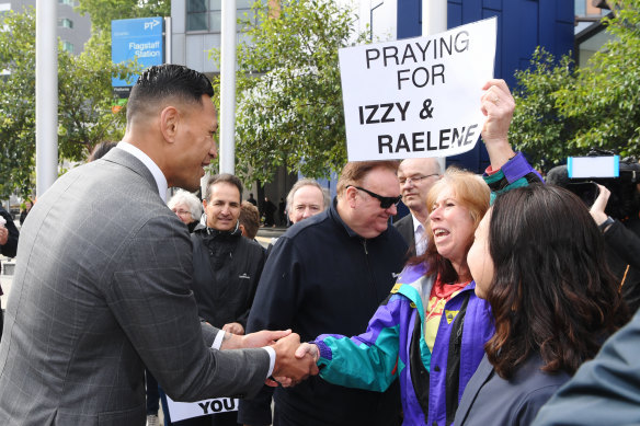 Israel Folau was greeted by supporters on his arrival at the Federal Court on Monday before a settlement was reached.