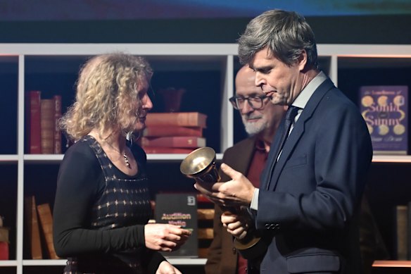 David Szalay receives the award from last year’s winner Samantha Harvey at Old Billingsgate in London.