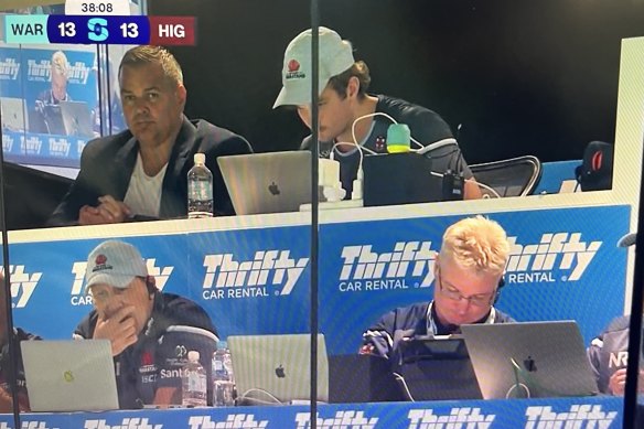 Manly coach Anthony Seibold in the back row of the Waratahs’ coaches box, with Jason Gilmore (left) and Darren Coleman (right) in the front row.