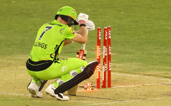 Sam Billings slumps to the ground after being dismissed in Perth on Saturday night.