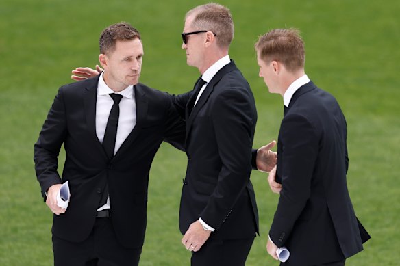 Joel, Adam and Scott Selwood at Troy Selwood’s funeral at GMHBA Stadium in Geelong earlier this year.