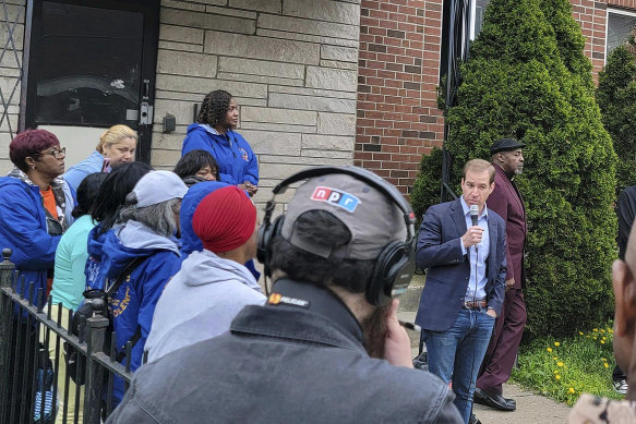 Hartford Mayor Luke Bronin addresses a crowd gathering for a vigil on the same street where Se’Cret Pierce, 12, was shot in the head by a stray bullet during a drive-by shooting.