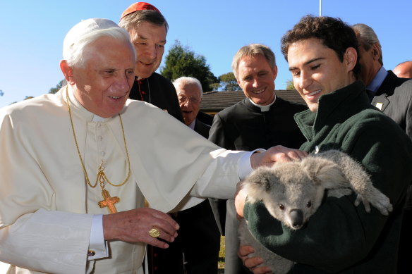 Pope Benedict XVI meeting a koala during his visit to Australia in 2008.