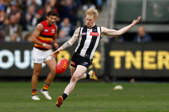 John Noble on the run for the  Magpies in the thriller against Adelaide on Sunday.