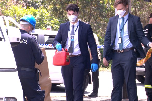 A detective leaves the crime scene at Lewis’ Continental Kitchen in Bondi.
