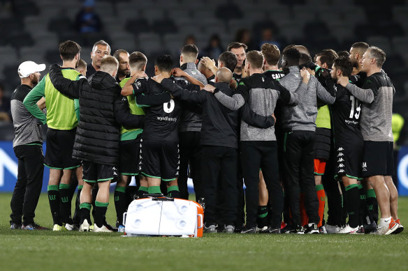 Mark Rudan speaks to his players after the semi-final loss to Melbourne City.