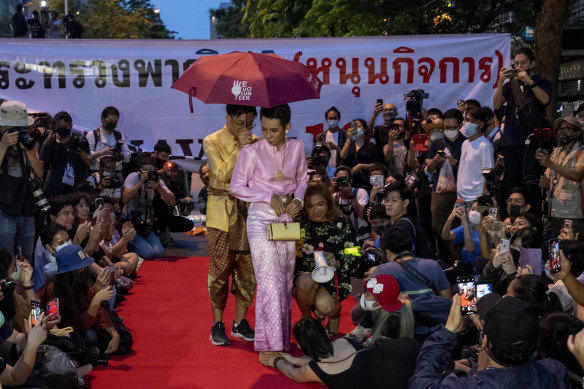 Pro-democracy protesters perform on a mock “red carpet” fashion show in October 2020.