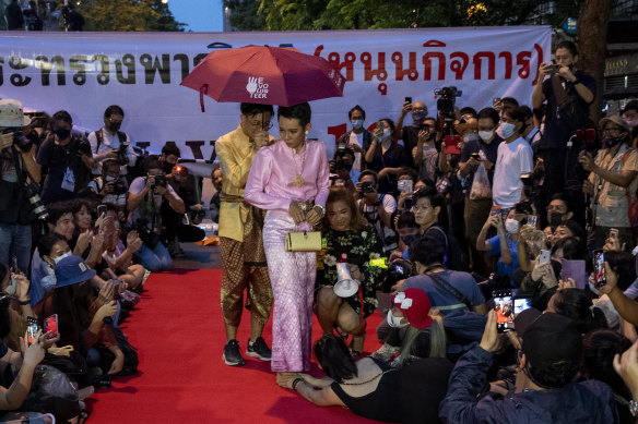 Pro-democracy protesters perform on a mock “red carpet” fashion show in October 2020.