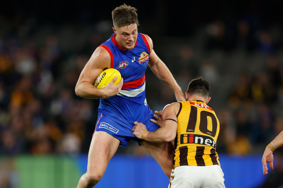 Josh Schache is caught by Jaeger O’Meara.