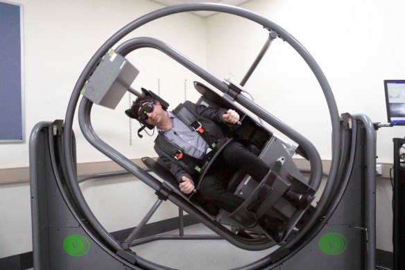 Neuro-otologist David Szmulewicz  in an Epley Omniax machine at the Royal Victorian Eye and Ear Hospital.