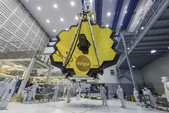 NASA technicians work on the James Webb telescope mirror in 2017.