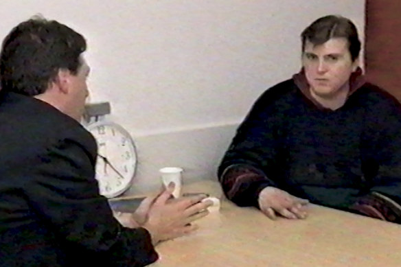 A detective interviews Paul Denyer in 1993.