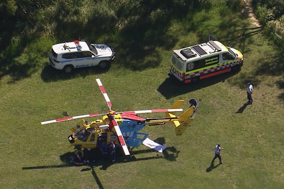 The rescue helicopter and ambulances at the scene where the man lost his life in the Royal National Park on Sunday.