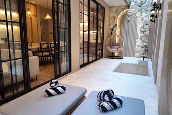 The Residence is a spacious retreat complete with living areas and a private outdoor hot tub. 