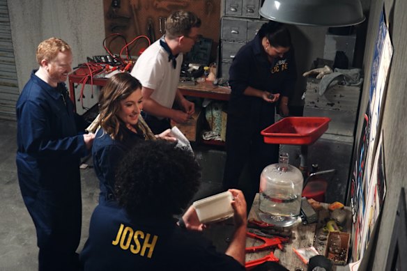 The comedians, including Luke McGregor and Celia Pacquola (left), find keys in the Mechanics Workshop in episode two of Celebrity Escape.  