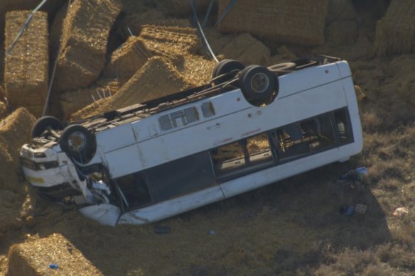 A bus driver was trapped for more than an hour after a school bus rolled in country Victoria.