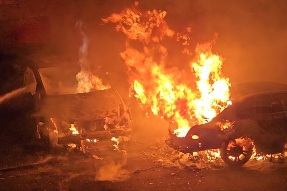 Cars outside the Dover Heights home were torched during the attack.