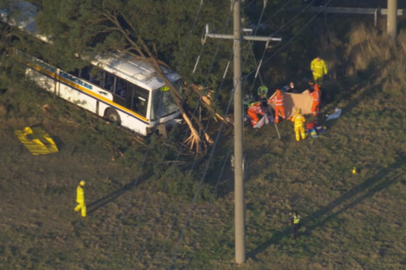 Emergency personnel at the scene of a bus crash.