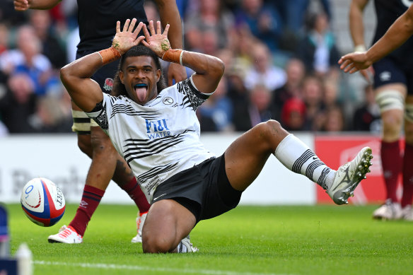 Simione Kuruvolia of Fiji celebrates scoring the team’s third try.