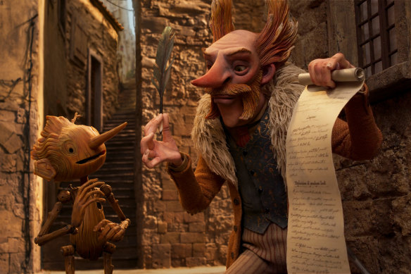  Christoph Waltz voices the villainous puppet showman Volpe (right) in Guillermo del Toro’s Pinocchio.  