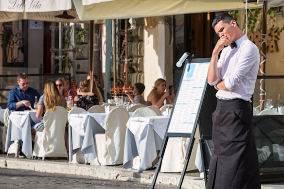 Waiters outside restaurants are often ready to pounce. 