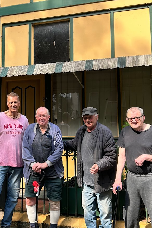Caretaker Clem Marchand, left, with Paddington’s boarding house residents.