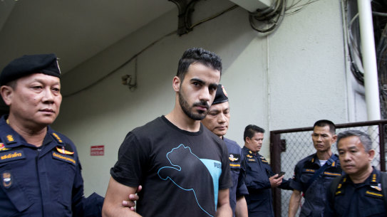 Thai prison guards lead Bahraini football player Hakeem al-Araibi, second left, from a court house in Bangkok, Thailand, Tuesday, Dec. 11, 2018