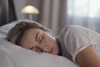 woman sleeping peacefully in her bed.