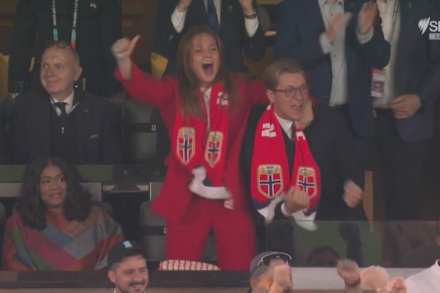 Princess Ingrid Alexandra and Prince Sverre Magnus celebrate a goal for Norway.