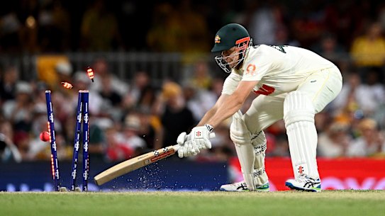 Brydon Carse bowls Australia’s all-rounder Cameron Green in a reckless period of batting in Brisbane.