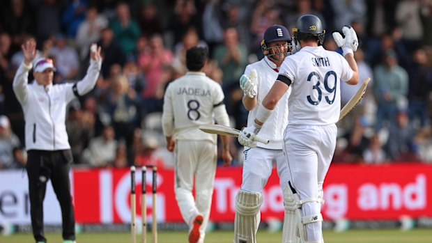 England’s Joe Root (second right) and batting partner Jamie Smith celebrate after their win on day five of the first Test against India at Headingley.