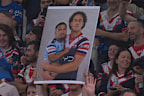 A fan made a sign of Mark Nawaqanitawase holding a baby-like Ronaldo Mulitalo for the semi final between the Sydney Roosters and Cronulla Sharks at Allianz Stadium.