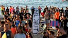A crowd gathers ahead of the paddle-out at Bondi Beach on Friday morning.