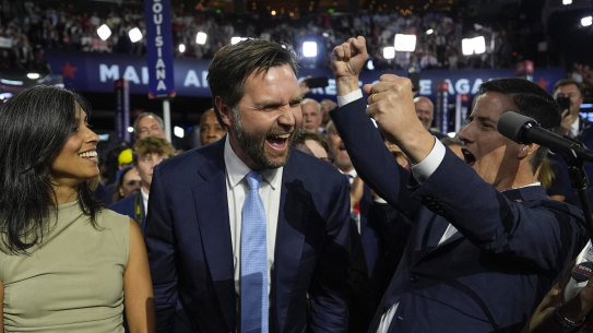 Republican vice presidential candidate Senator JD Vance and his wife Usha Chilukuri Vance arrive on the floor during the first day of the 2024 Republican National Convention.