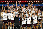 The Broncos lift the Provan-Summons Trophy. 