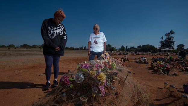 Sherona Roe and Carol Roe at the grave of  Ms Dhu in the Geraldton cemetery. 