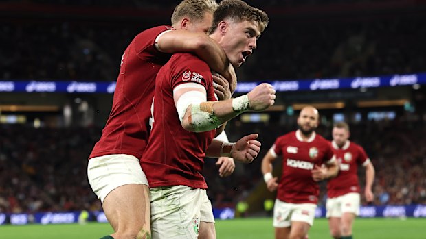 Tommy Freeman celebrates a try for the Lions.