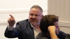 Damon Hanlin in a heated exchange with members at a Sydney Olympic FC annual general meeting in April.