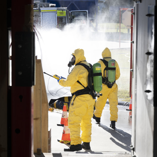 A group of trainees work their way through a mock drug lab set up in Orchard Hills, Sydney.
