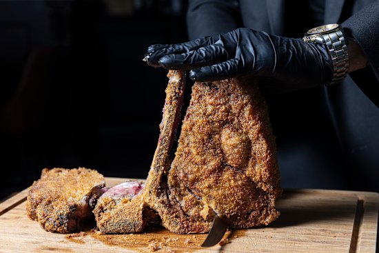 Bistecca fritta, a crumbed T-bone steak pan-fried in clarified butter then finished in the oven, is carved tableside at Made In Casa.