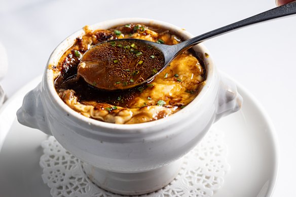 The soup's base is a reduced beef stock of depth and distinction; its cheesy topping grilled to melty magnificence.
