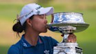 Minjee Lee kisses the trophy after winning the Women’s PGA Championship golf tournament  in Texas. 