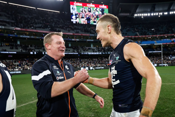 Patrick Cripps celebrates with Michael Voss after the win