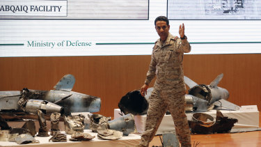 Saudi military spokesman Colonel Turki al-Malki displays what he describes as an Iranian cruise missile and drones.