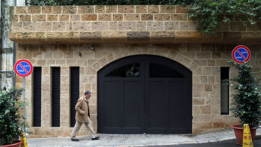 A pedestrian passes the garage at the property of Carlos Ghosn, former head of Nissan and Renault, in Beirut, Lebanon.